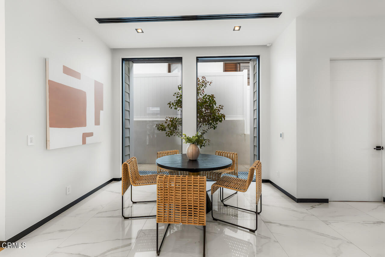 868 9th Street Manhattan Beach, CA 90266 - Photo 10 of 46 a living room with furniture and a potted plant