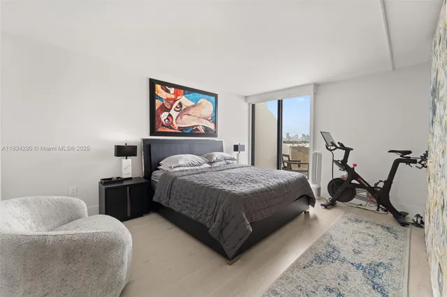 a bathroom with a toilet sink double vanity and mirror