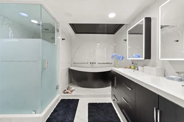 a bathroom with a sink double vanity granite and a mirror
