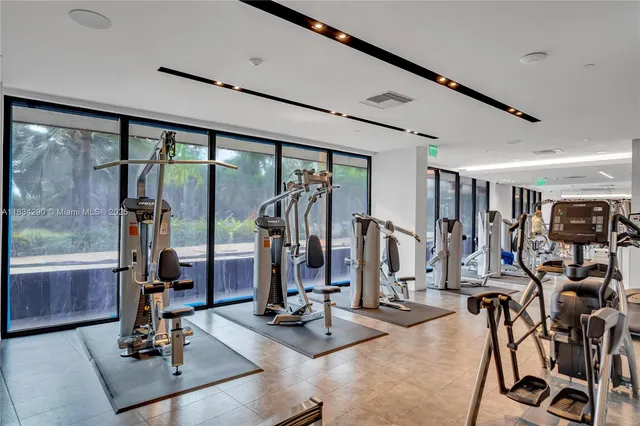 a view of a dining room with furniture and a chandelier