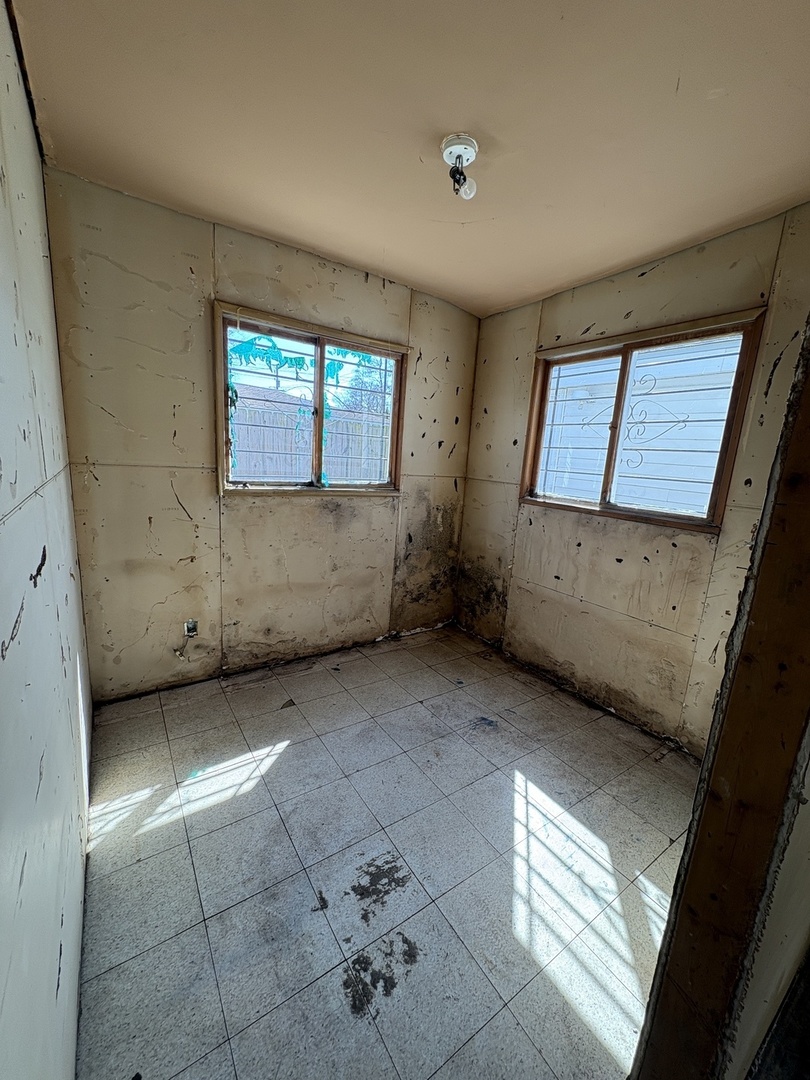 17226 Community Street Lansing, IL 60438 - Photo 19 of 24 an empty room with windows