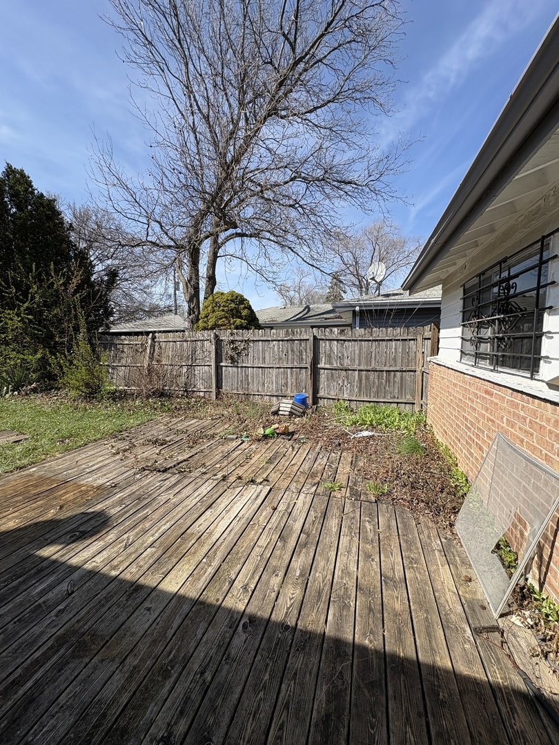 17226 Community Street Lansing, IL 60438 - Photo 20 of 24 a view of backyard with a wooden deck