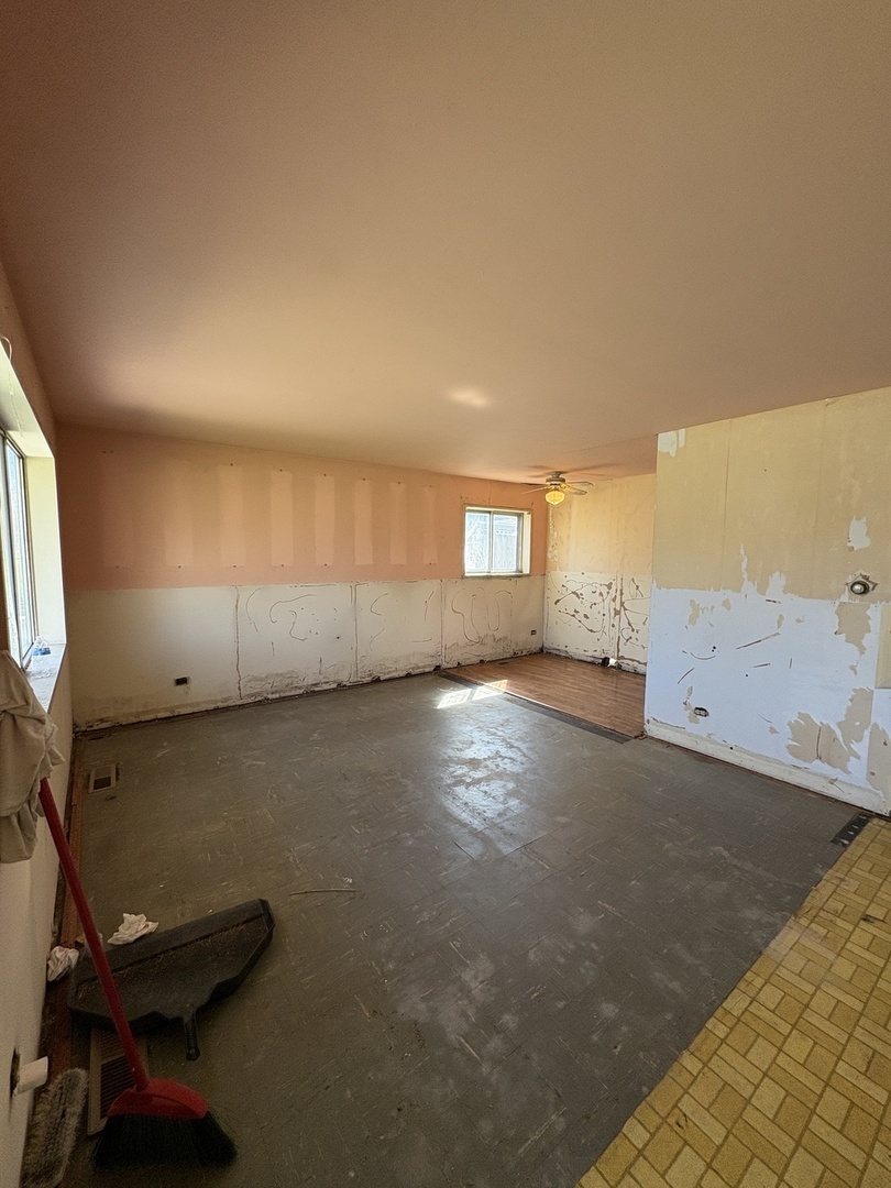 17226 Community Street Lansing, IL 60438 - Photo 4 of 24 an empty room with windows