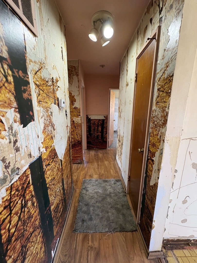 17226 Community Street Lansing, IL 60438 - Photo 5 of 24 a view of a porch with wooden floor and stairs