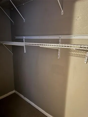 a view of a room with racks on the wall