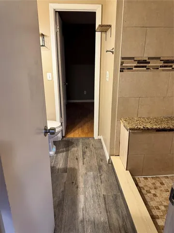 an empty room with wooden floor