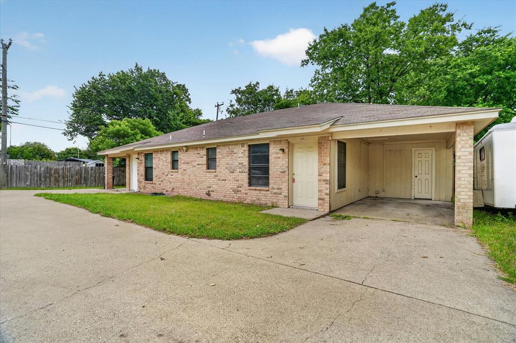 119 Del Rio Avenue, Unit C Benbrook, TX 76126 - Photo 2 of 17 front view of house with a yard