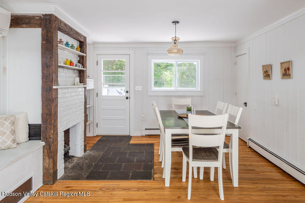 347 Hickory Bush Road Kingston, NY 12401 - Photo 11 of 44 a view of a dining room with furniture and wooden floor