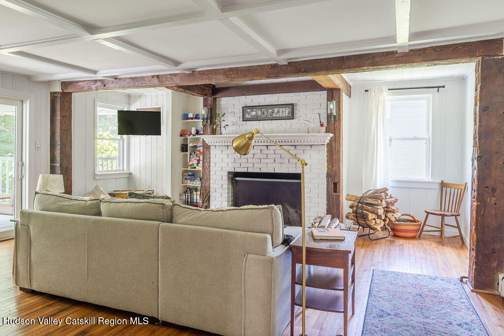 347 Hickory Bush Road Kingston, NY 12401 - Photo 14 of 44 a living room with furniture and a fireplace
