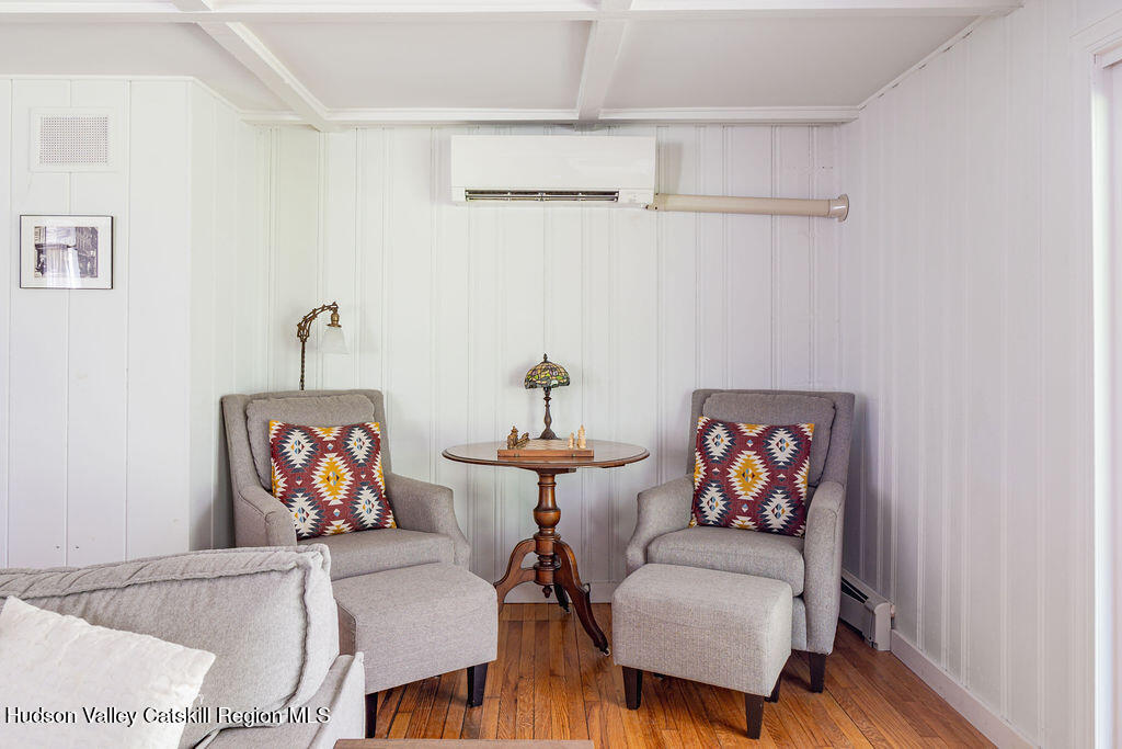 347 Hickory Bush Road Kingston, NY 12401 - Photo 16 of 44 a living room with furniture and a wooden floor