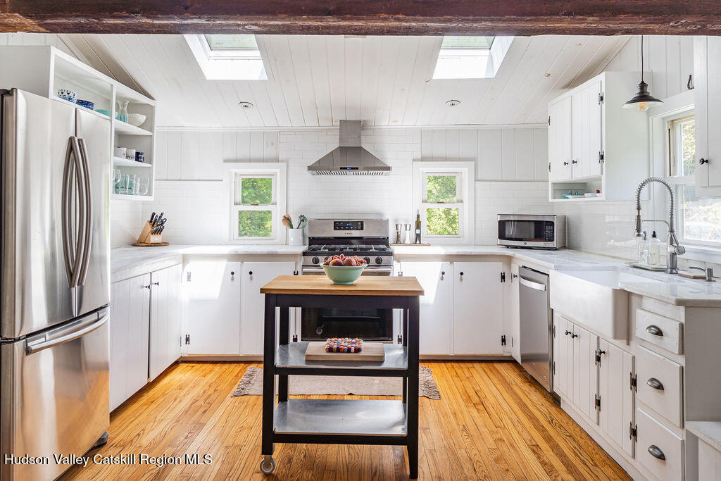347 Hickory Bush Road Kingston, NY 12401 - Photo 2 of 44 a kitchen with stainless steel appliances a stove a sink cabinets and a refrigerator