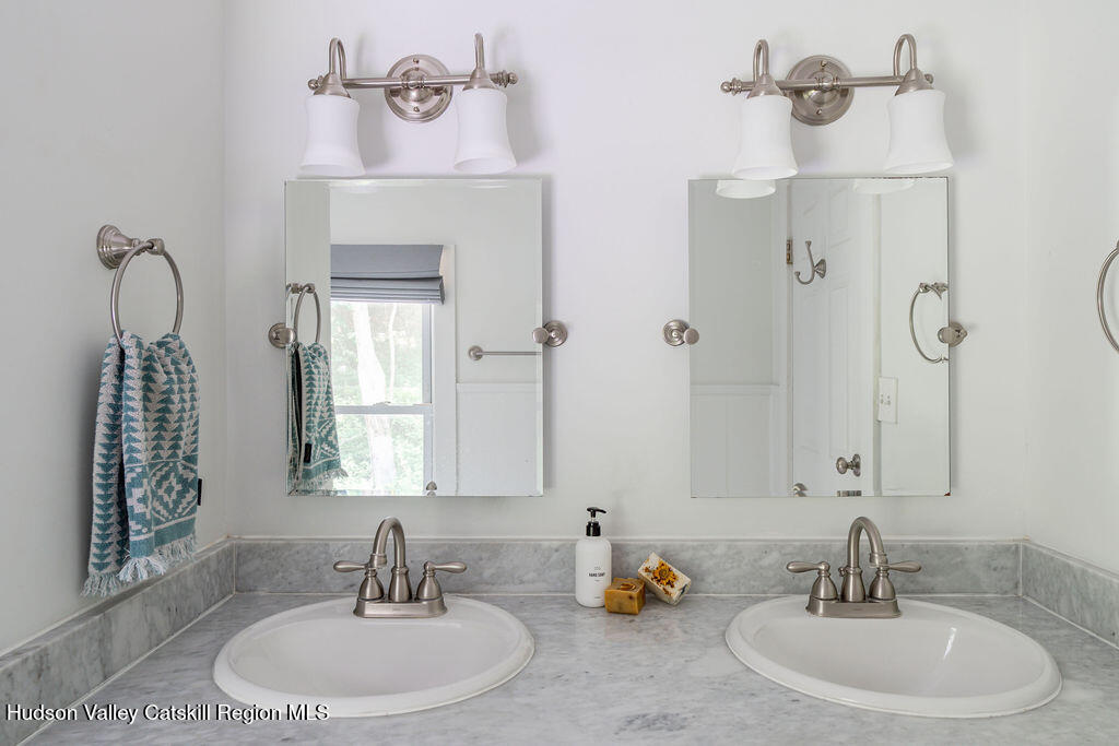 347 Hickory Bush Road Kingston, NY 12401 - Photo 25 of 44 a bathroom with a sink and a mirror