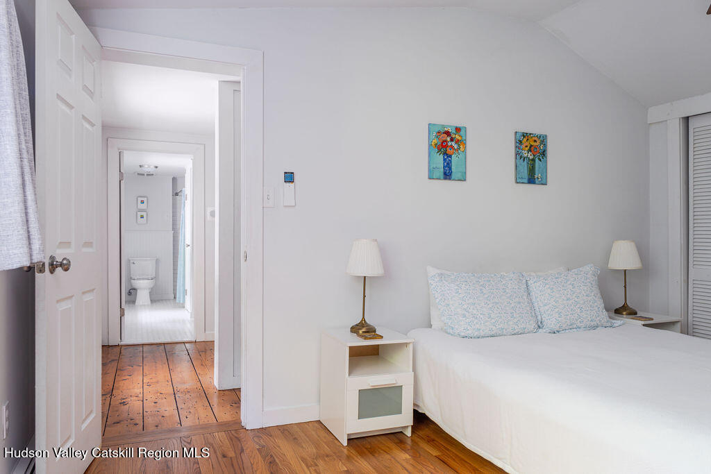 347 Hickory Bush Road Kingston, NY 12401 - Photo 29 of 44 a bedroom with a bed and a lamp