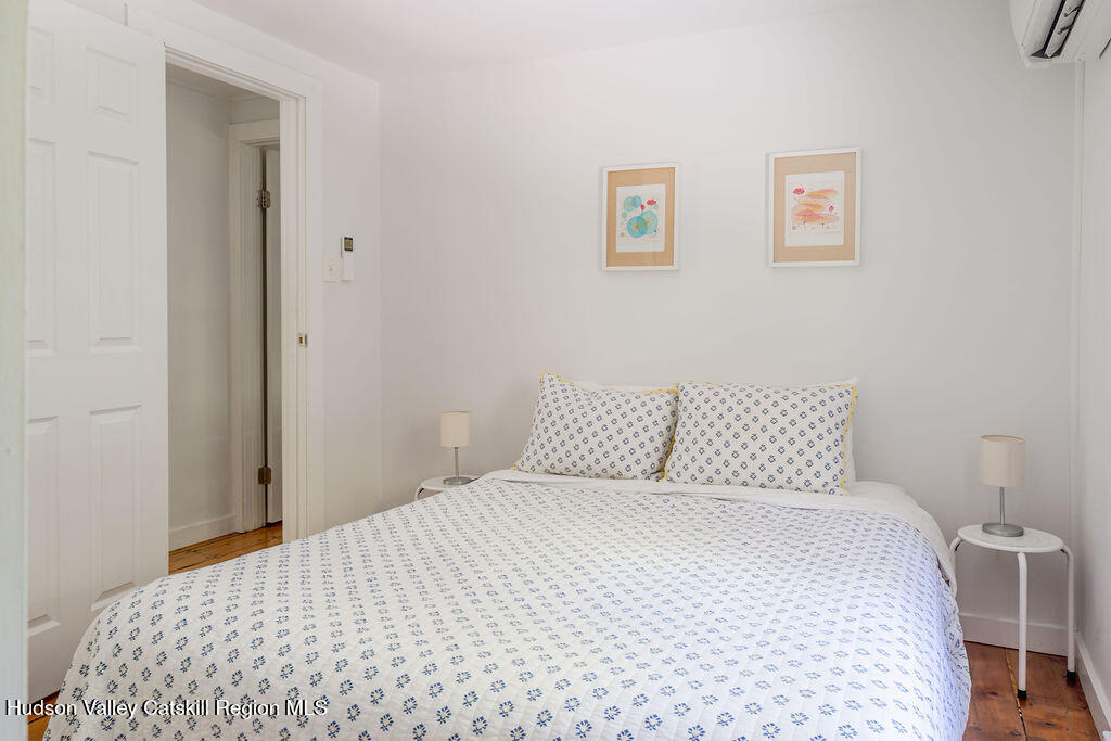 347 Hickory Bush Road Kingston, NY 12401 - Photo 31 of 44 a bedroom with a bed and painting on the wall