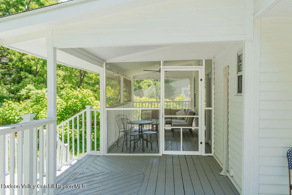 347 Hickory Bush Road Kingston, NY 12401 - Photo 36 of 44 a view of a balcony with chairs and wooden floor