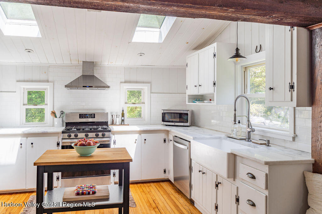 347 Hickory Bush Road Kingston, NY 12401 - Photo 9 of 44 a kitchen with stainless steel appliances a stove a sink and a refrigerator
