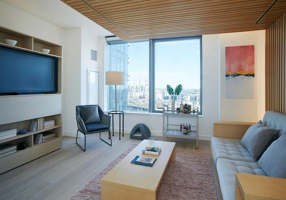 3 Court Square, Unit 2306 Queens, NY 11101 - Photo 2 of 10 Living area with wood finished floors and wood ceiling