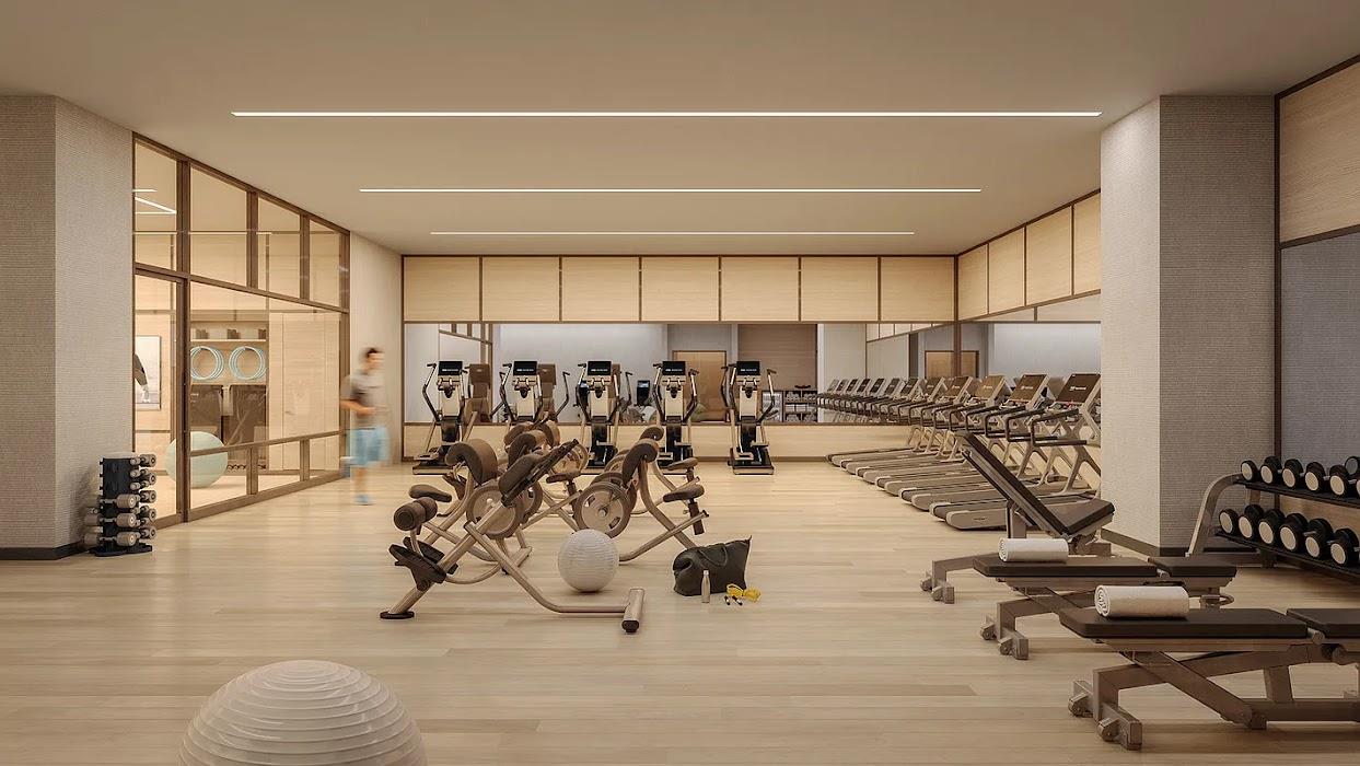 3 Court Square, Unit 2306 Queens, NY 11101 - Photo 8 of 10 Workout area with a wall of windows and light wood finished floors