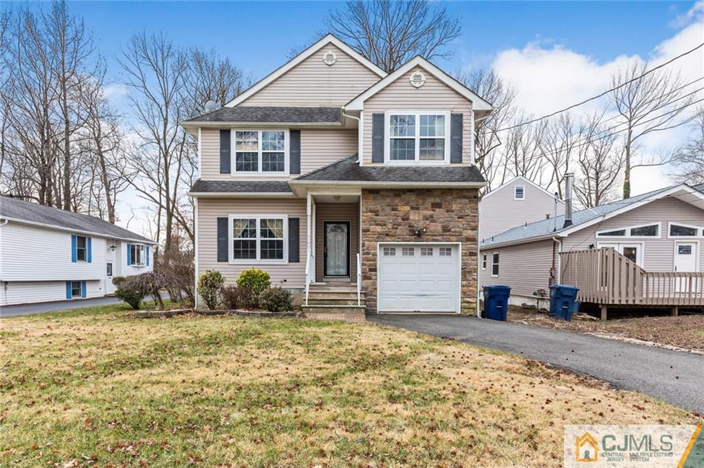 710 Spruce Road North Brunswick, NJ 08902 - Photo 3 of 28 a front view of a house with a yard