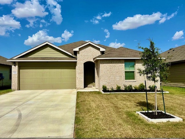 544 Taggart Trail Jarrell, TX 76537 - Photo 1 of 19 a front view of a house with a yard