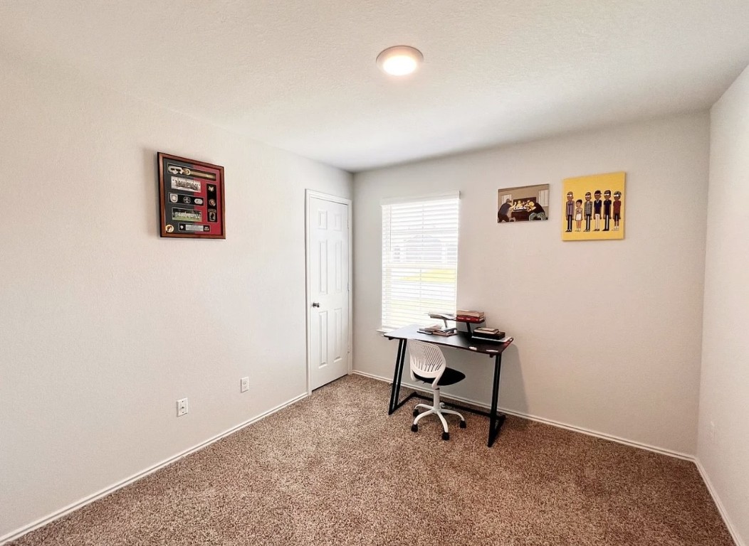 544 Taggart Trail Jarrell, TX 76537 - Photo 13 of 19 a view of a workspace with furniture and a window