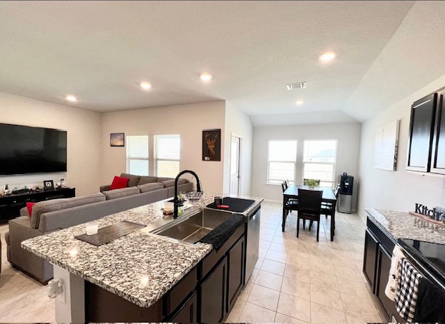 544 Taggart Trail Jarrell, TX 76537 - Photo 18 of 19 a kitchen island with granite countertop a table and chairs