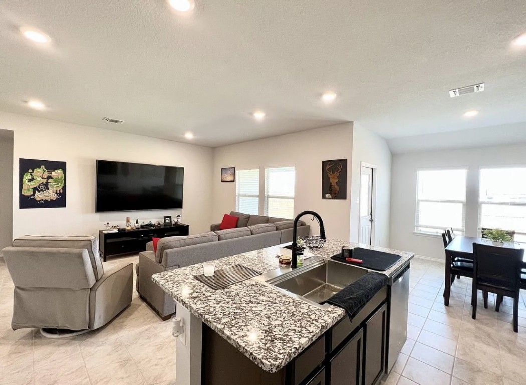 544 Taggart Trail Jarrell, TX 76537 - Photo 19 of 19 a living room with furniture and a flat screen tv