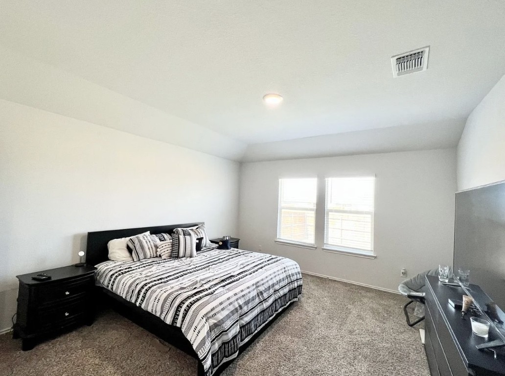 544 Taggart Trail Jarrell, TX 76537 - Photo 7 of 19 a bedroom with a bed and window