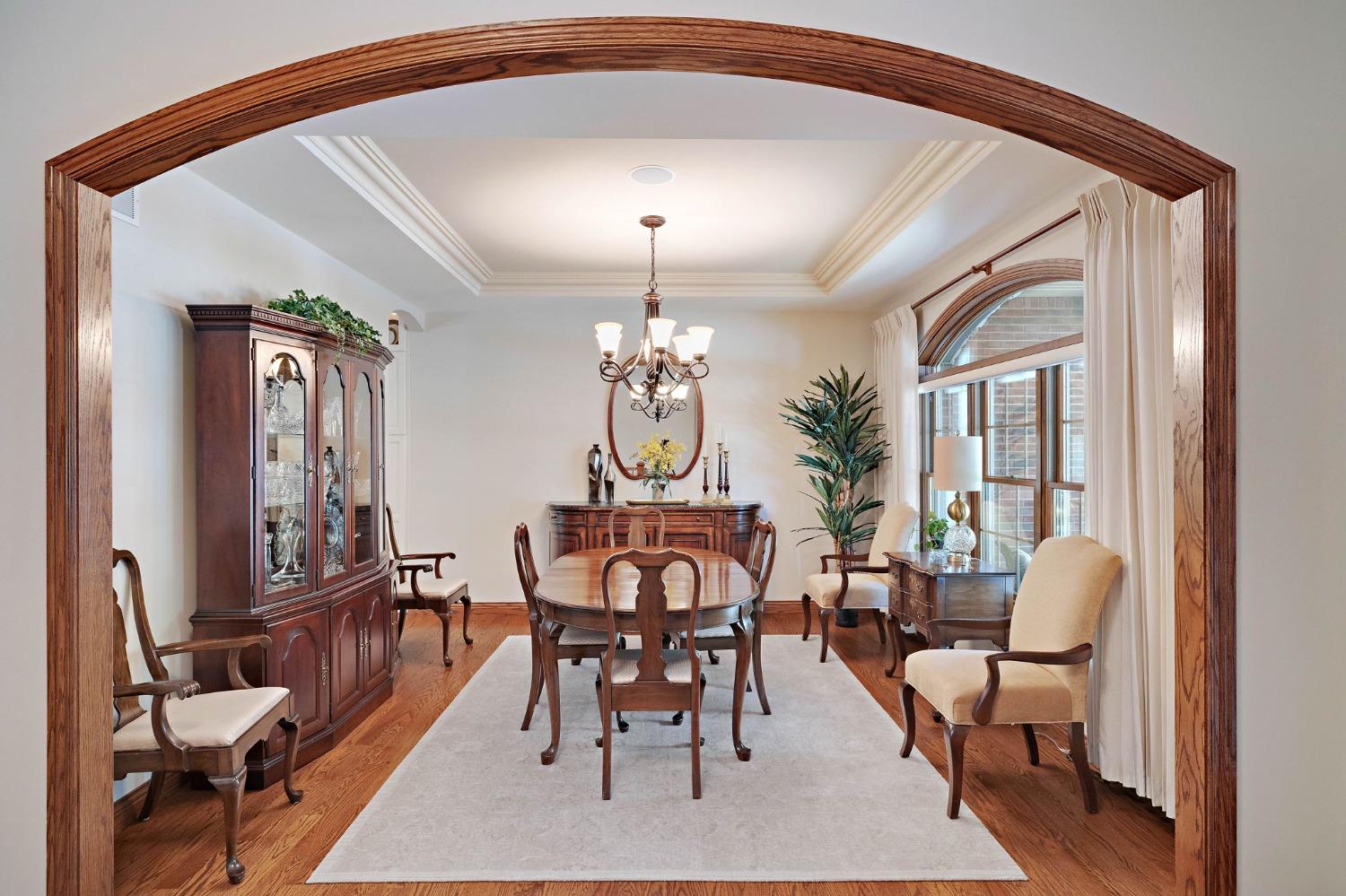 770 Quinlan Court Crown Point, IN 46307 - Photo 11 of 53 a view of a dining room with furniture and a chandelier