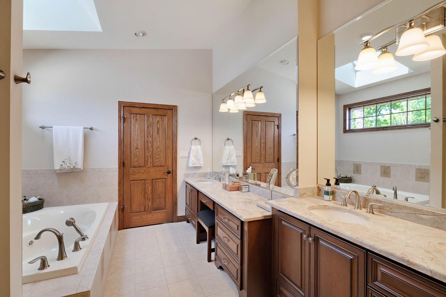 770 Quinlan Court Crown Point, IN 46307 - Photo 27 of 53 a bathroom with a sink double vanity granite and a mirror
