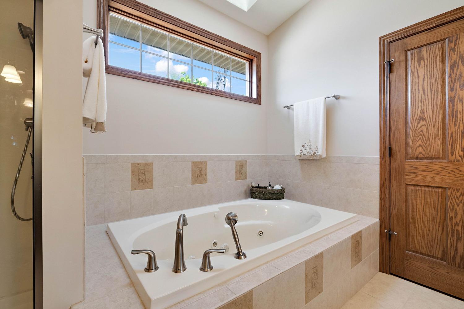 770 Quinlan Court Crown Point, IN 46307 - Photo 28 of 53 a bathroom with a bathtub and a shower