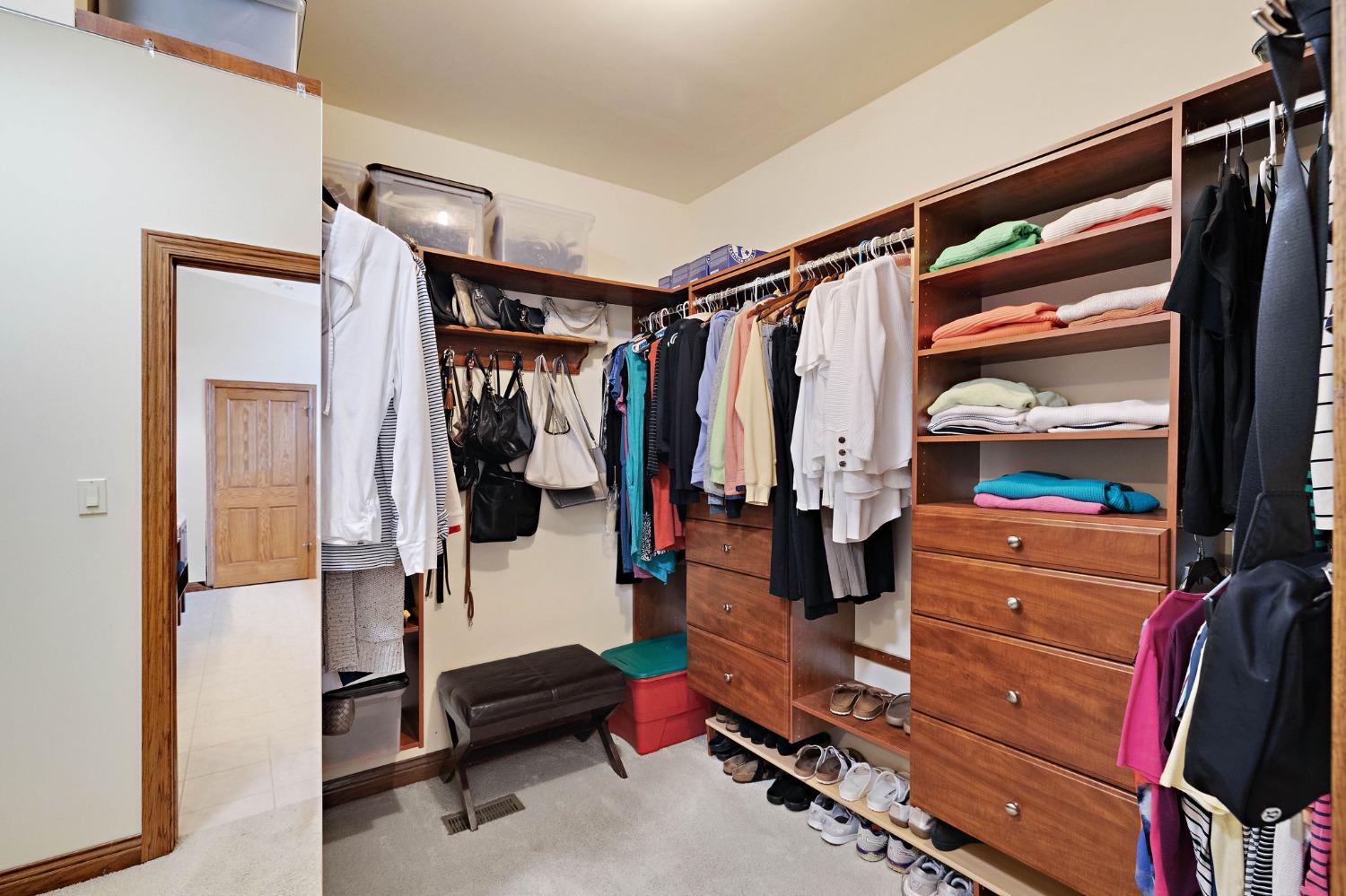 770 Quinlan Court Crown Point, IN 46307 - Photo 29 of 53 a view of walk in closet with clothes and shoes