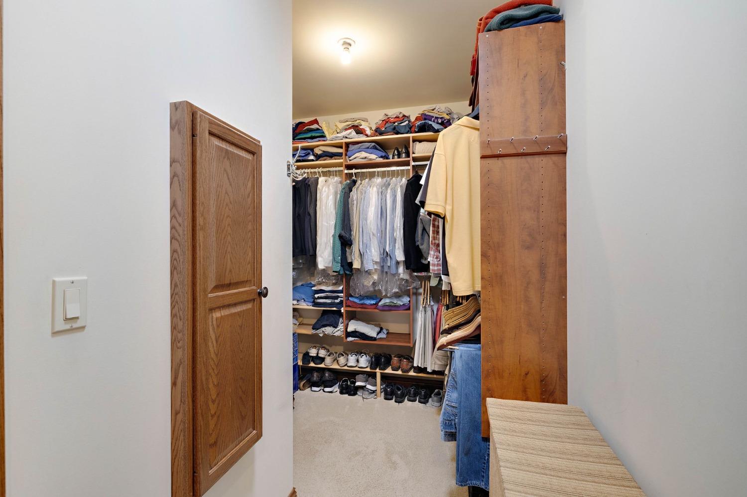 770 Quinlan Court Crown Point, IN 46307 - Photo 30 of 53 a view of walk in closet with clothes and shoes