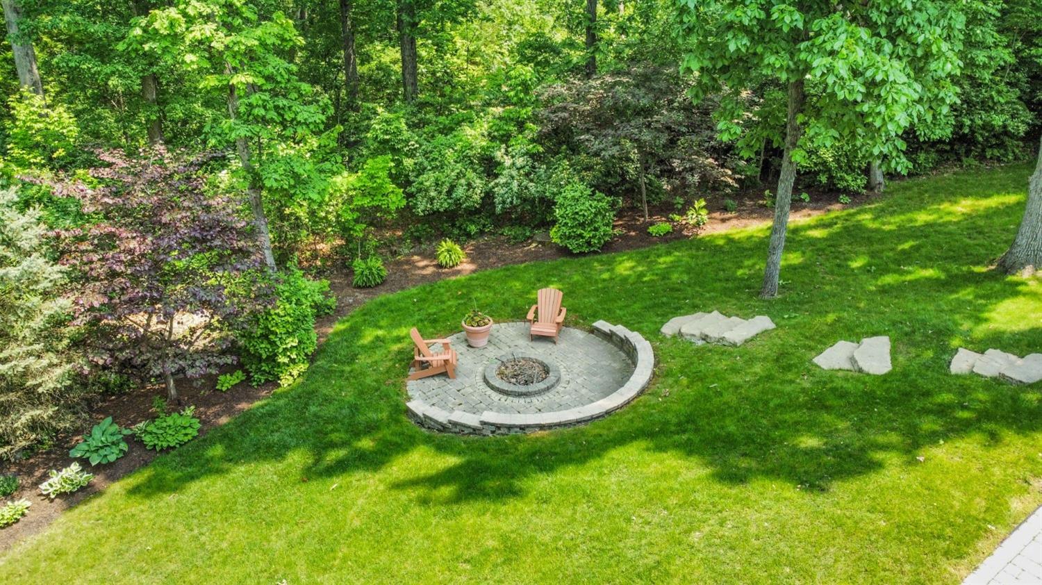 770 Quinlan Court Crown Point, IN 46307 - Photo 52 of 53 a backyard of a house with table and chairs a fire pit