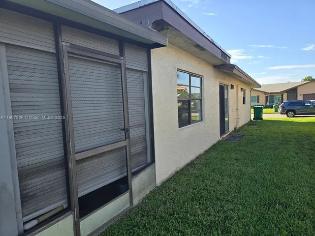a kitchen with sink cabinets and window