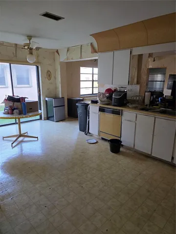 a work room with furniture and a window