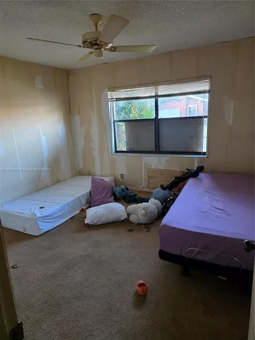 a bathroom with a sink and mirror with toilet