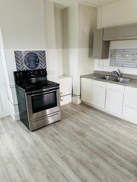 159 College Street, Unit 3 Springfield, MA 01109 - Photo 1 of 1 a kitchen with granite countertop a stove and a sink