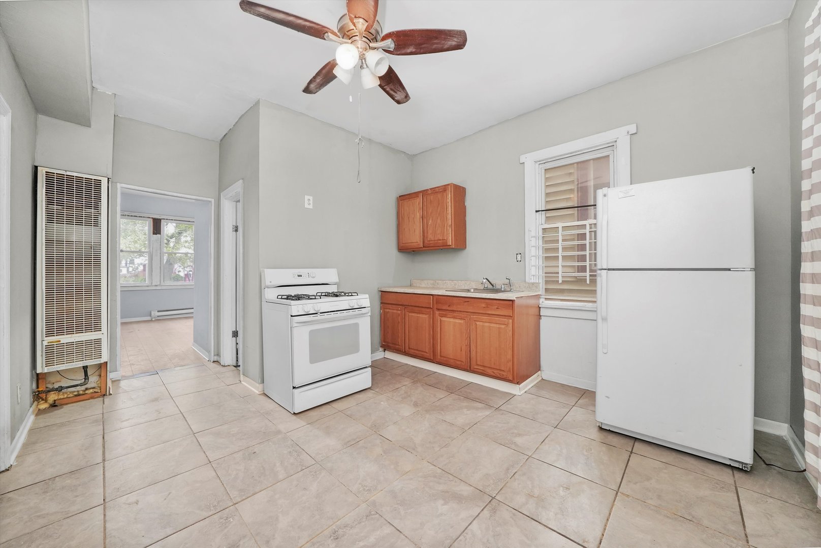 5014 South Paulina Street Chicago, IL 60609 - Photo 14 of 38 a kitchen with a refrigerator and a stove top oven