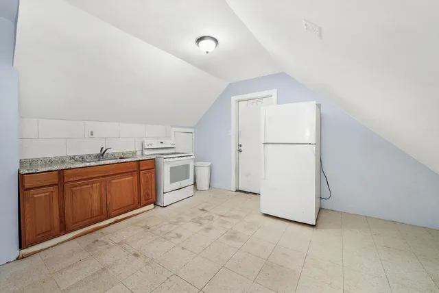 a view of a storage & utility room with a sink