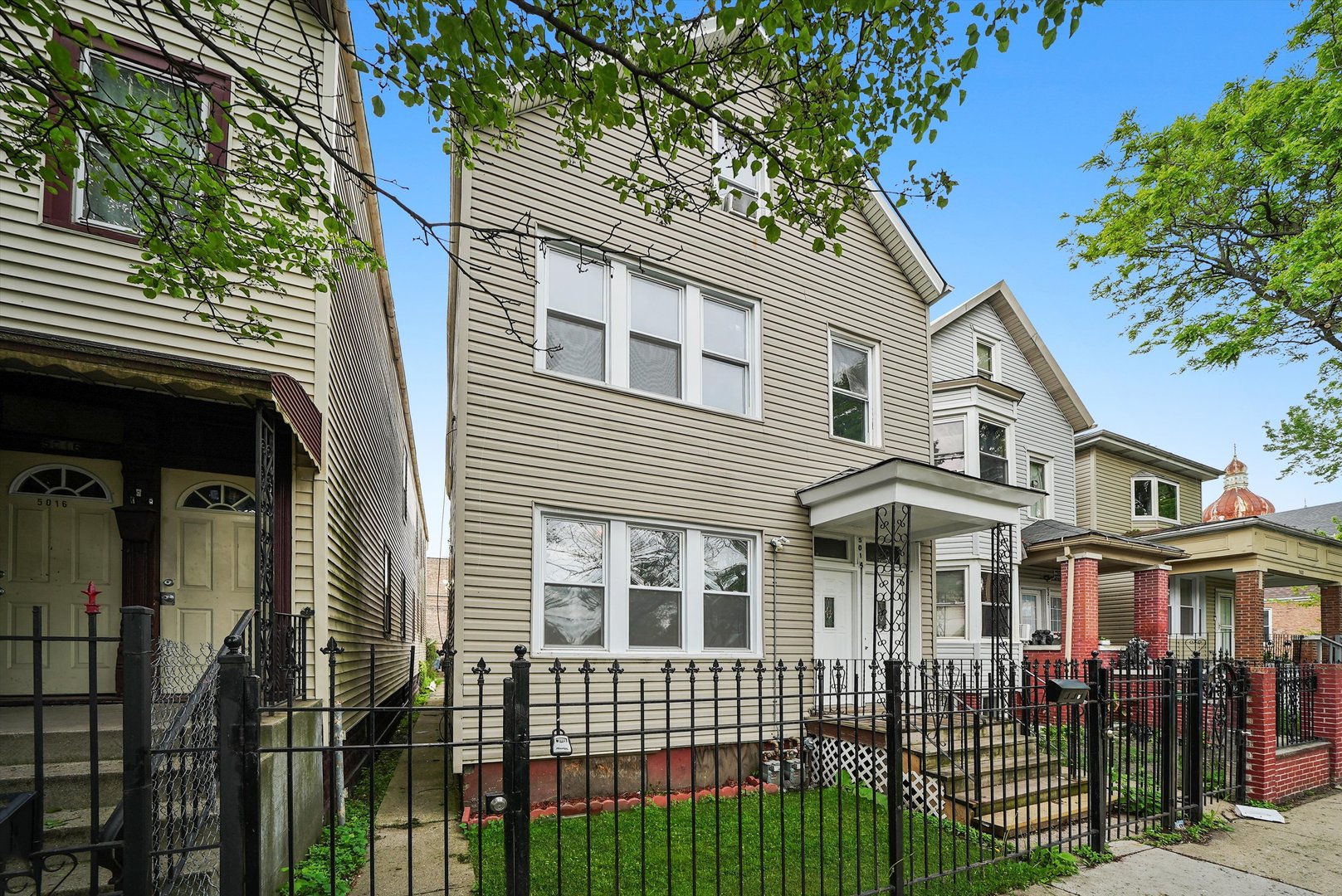 5014 South Paulina Street Chicago, IL 60609 - Photo 3 of 38 a front view of a house with a porch
