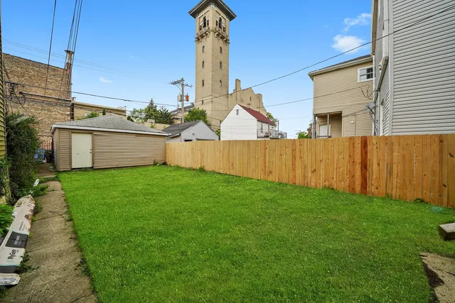 a view of a backyard with potted plants