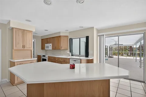 a room with a large window and counter space