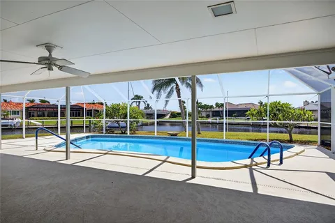 a view of swimming pool with lounge chair