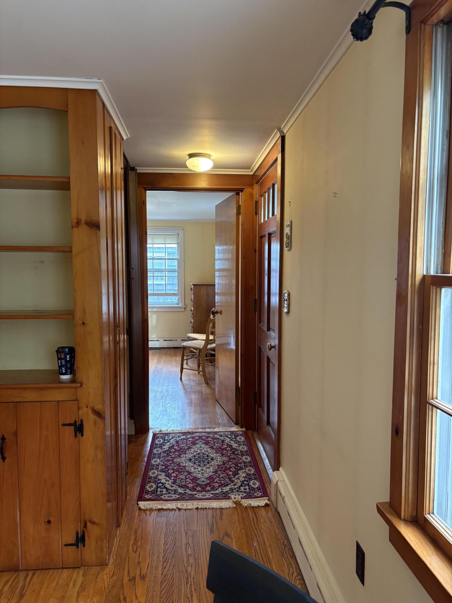 606 County Road Pocasset, MA 02559 - Photo 14 of 36 a view of livingroom with hardwood floor and a window