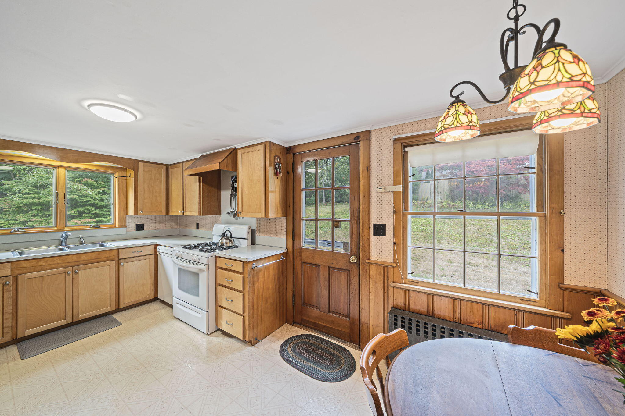 606 County Road Pocasset, MA 02559 - Photo 15 of 36 a room with kitchen island granite countertop a stove and a sink