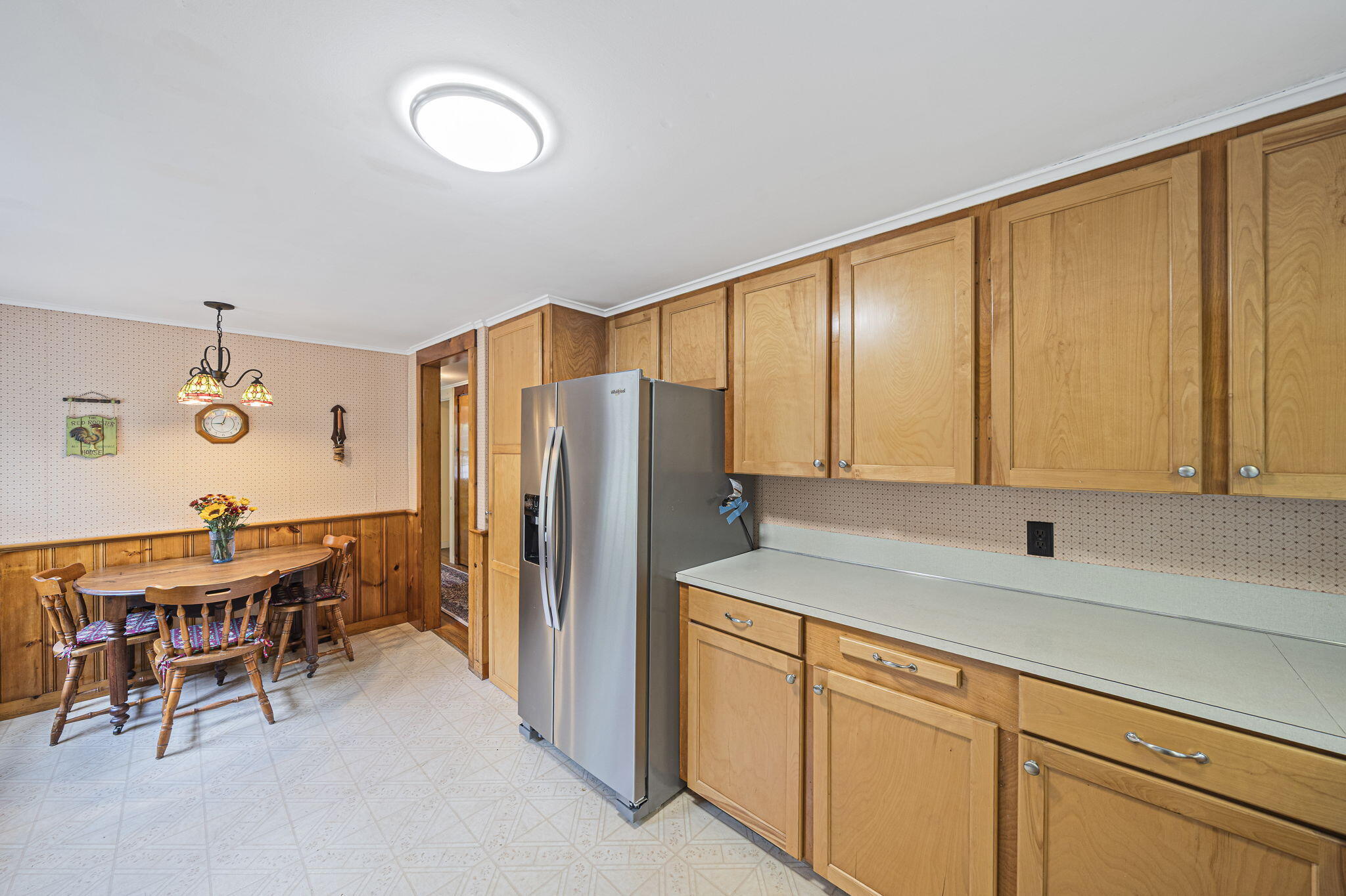 606 County Road Pocasset, MA 02559 - Photo 16 of 36 a kitchen with stainless steel appliances granite countertop a refrigerator sink and white cabinets