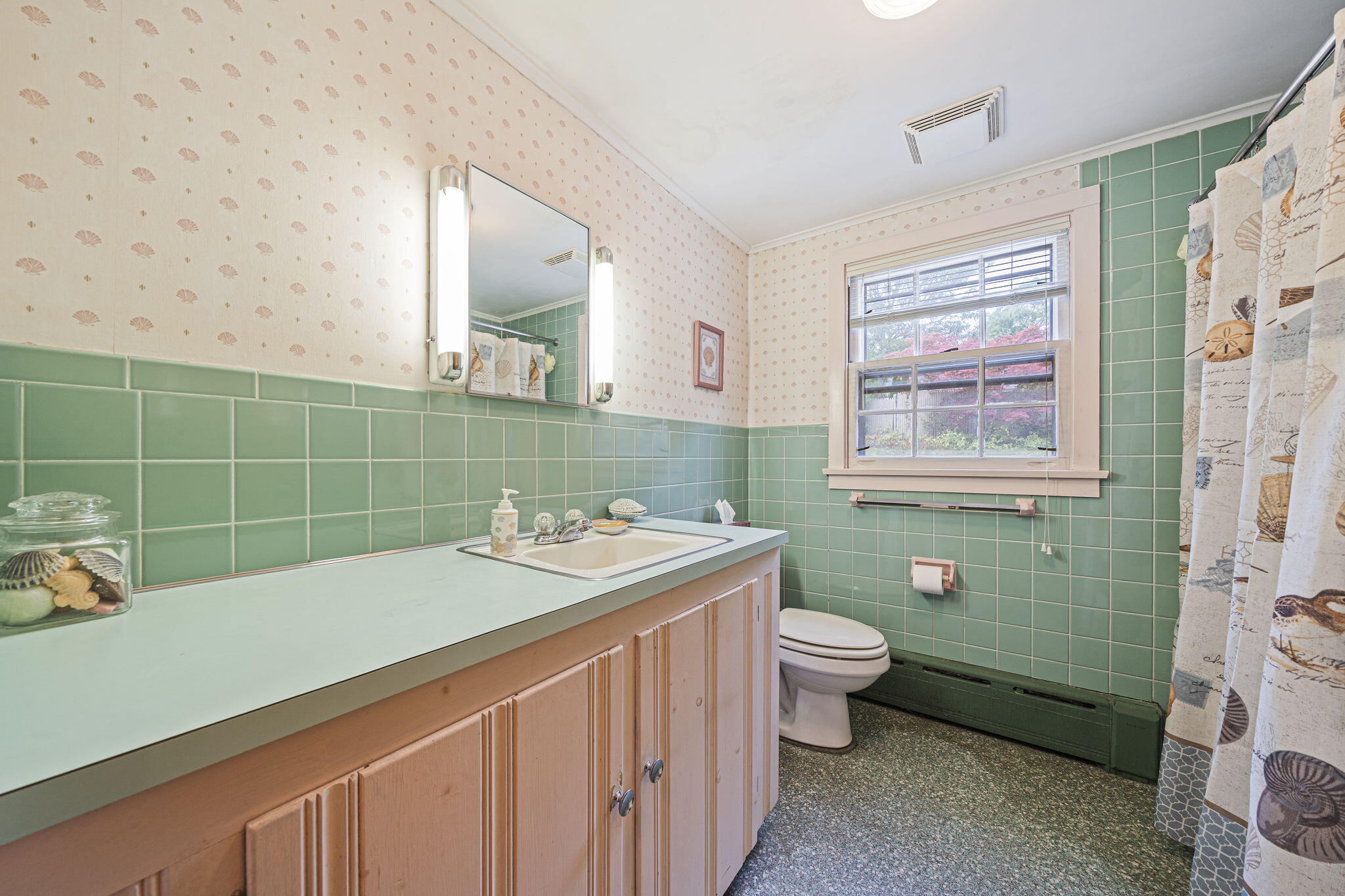 606 County Road Pocasset, MA 02559 - Photo 18 of 36 a bathroom with a sink mirror toilet and next to a window