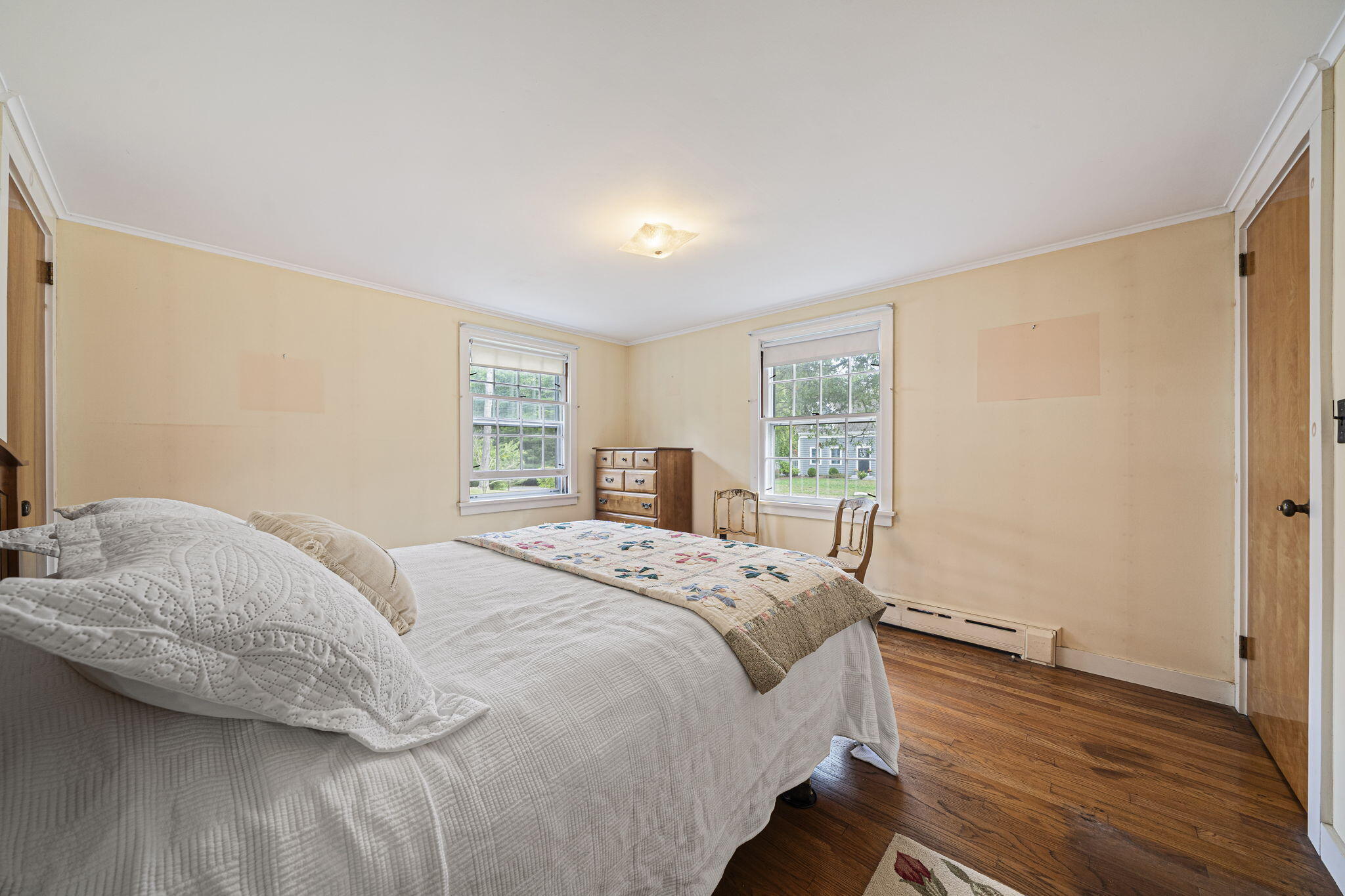606 County Road Pocasset, MA 02559 - Photo 19 of 36 a bedroom with a bed and wooden floor