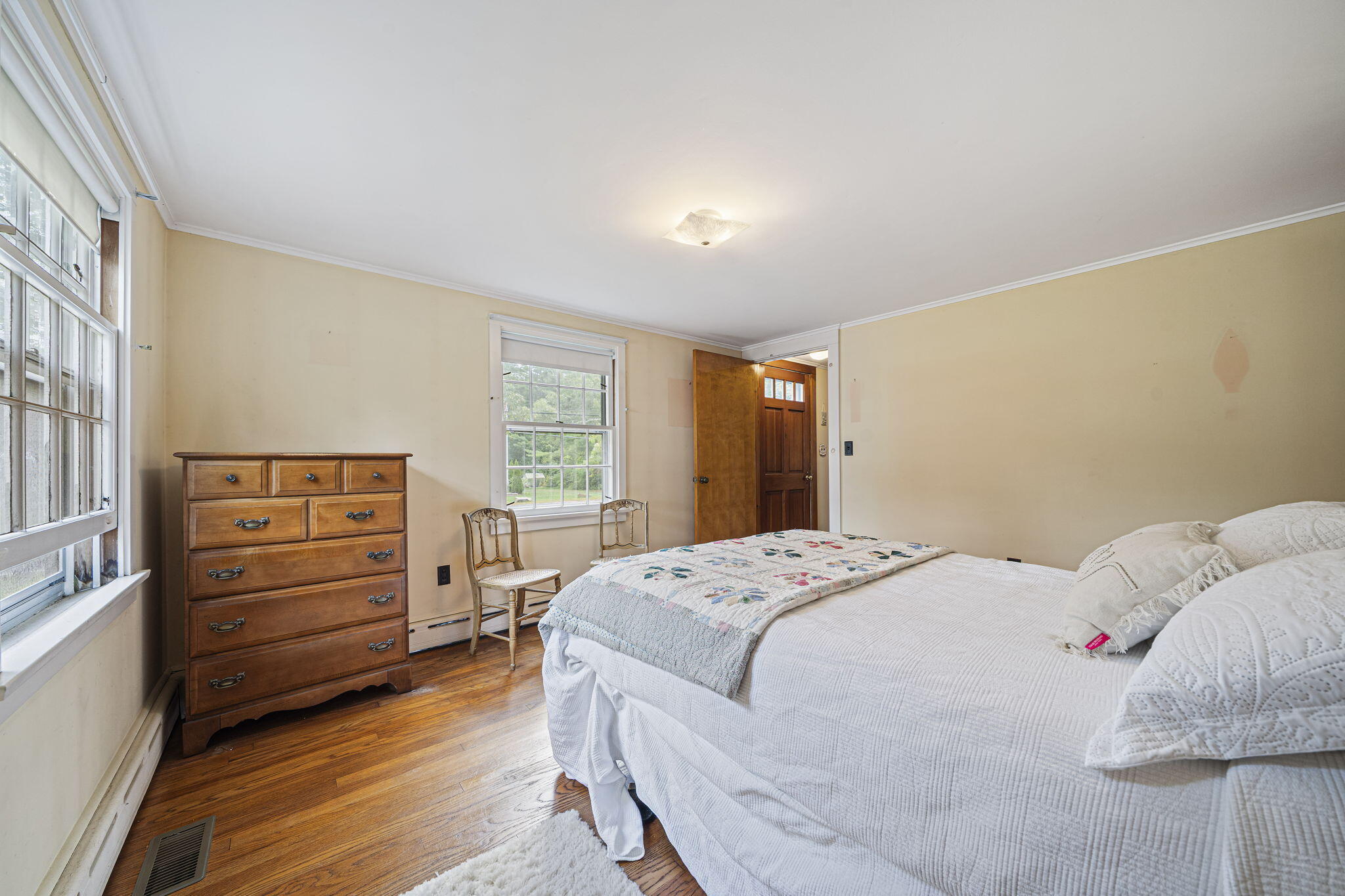 606 County Road Pocasset, MA 02559 - Photo 20 of 36 a bedroom with a bed and a dresser